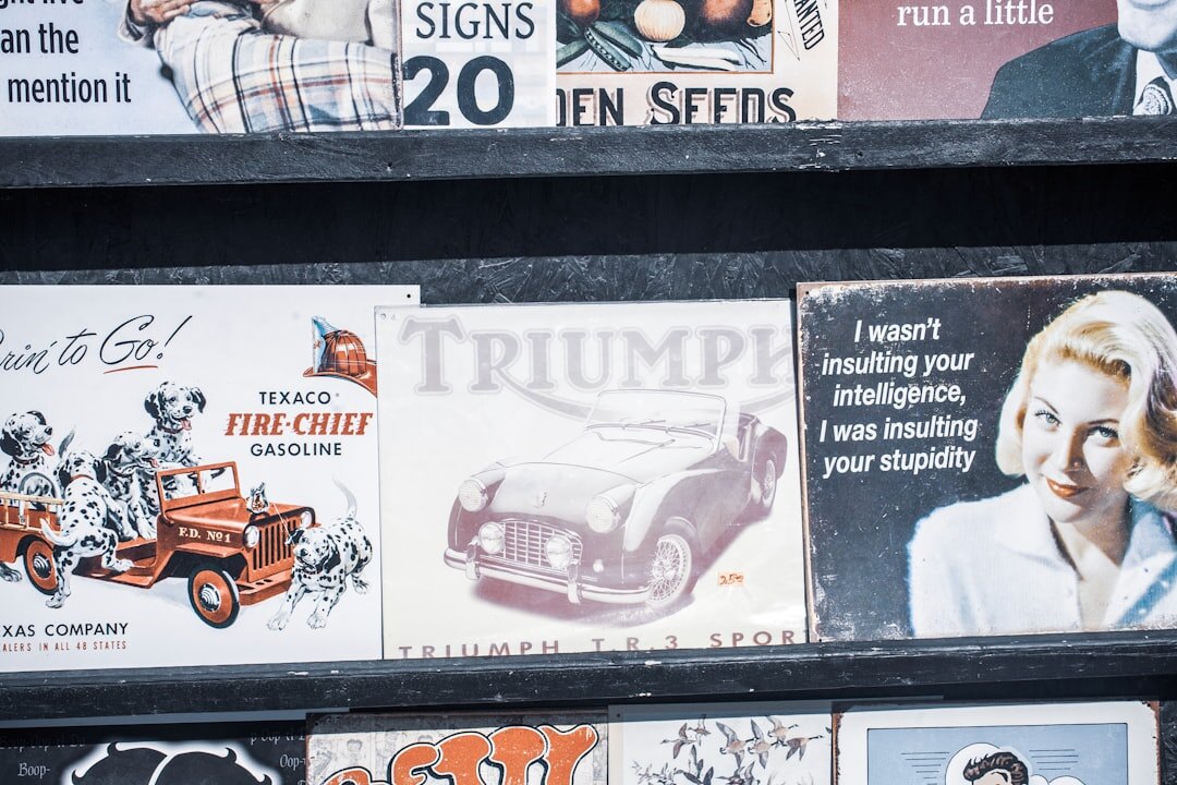 Wall covered in colourful vintage advertising posters